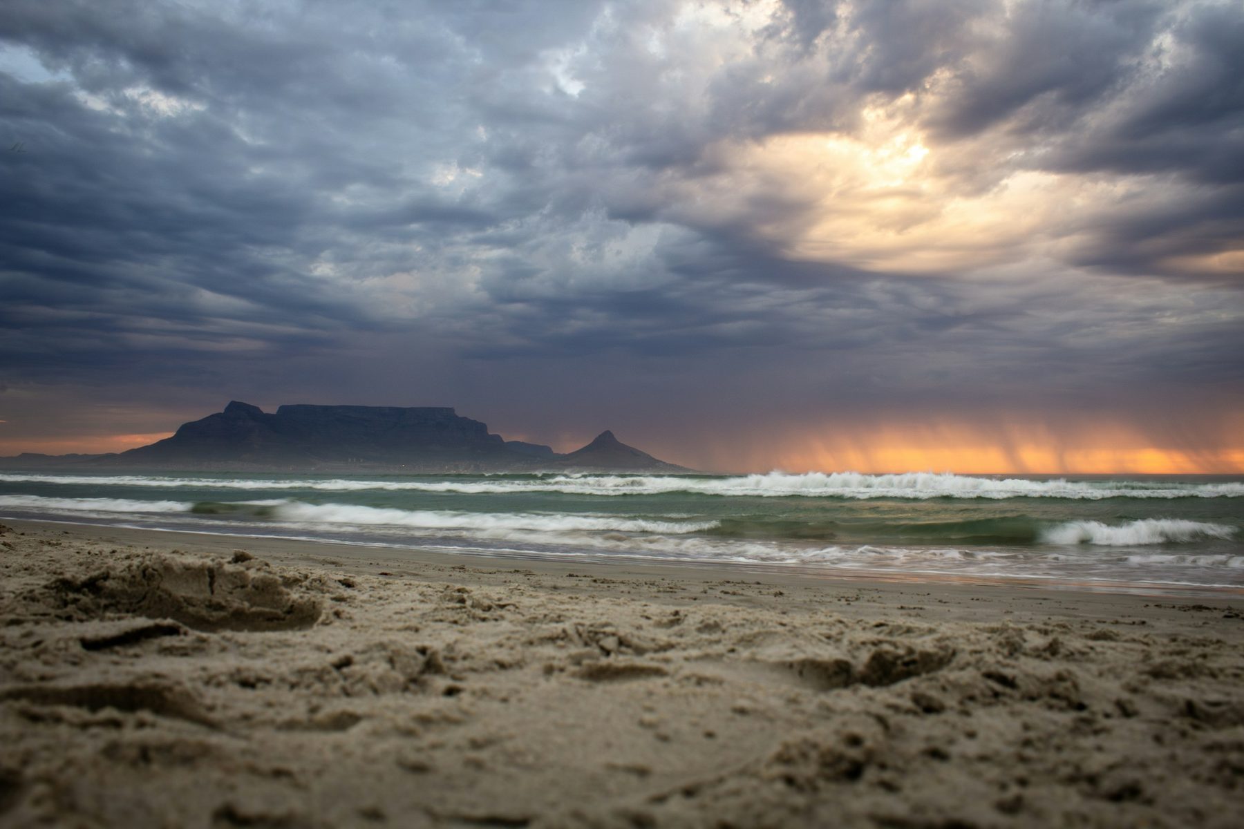 Sunset over Table Bay seen from Bloubergstrand, with Table Mountain and Lion's Head in silhouette